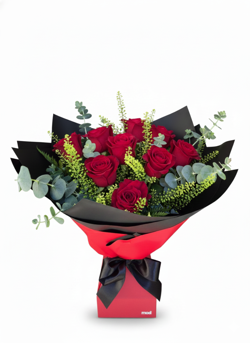 Breathtaking arrangement of twelve premium red roses in a self-watering Vox box, hand-crafted for romantic delivery in South Auckland.