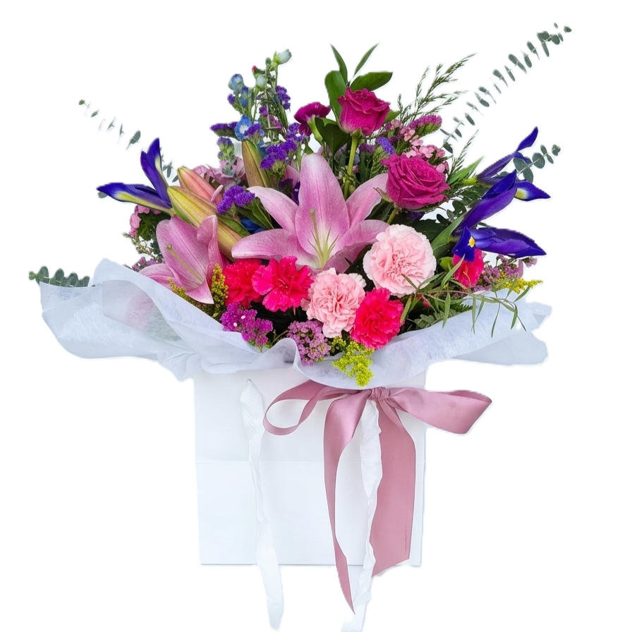 A vibrant wrapped bouquet of top quality premium bright flowers with fresh seasonal greenery