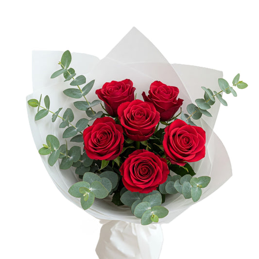Elegant beloved blossoms bouquet featuring six premium red roses and fresh seasonal greenery, hand-crafted for romantic delivery in South Auckland.