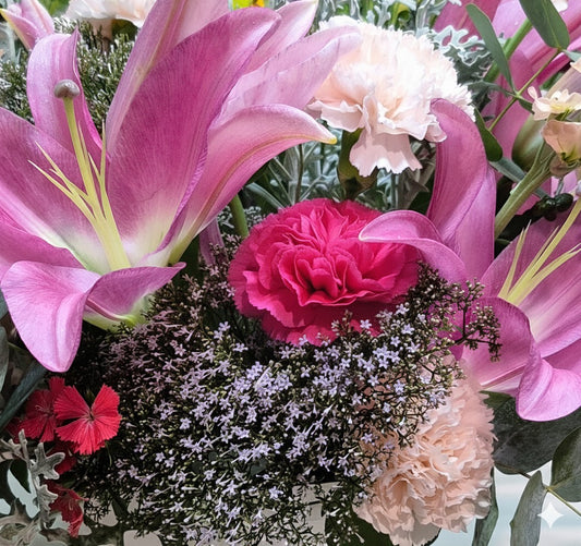 Beautiful blushing pink flower bouquet hand-crafted for celebration and romance delivery in South Auckland by local growers.