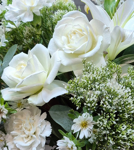 Elegant white and cream flower bouquet featuring fresh seasonal blooms, hand-crafted for delivery in Auckland by Flowers on Ramarama.