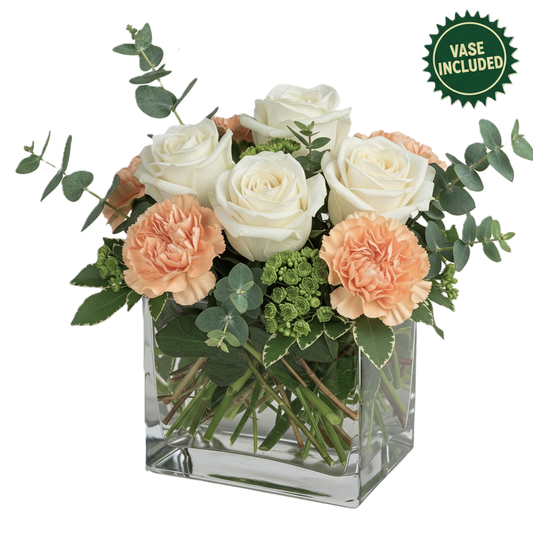 Chic gentle grace arrangement featuring white roses and peach carnations in a modern square glass vase, hand-crafted in South Auckland.