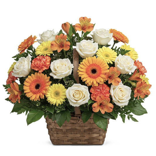 Respectful gentle remembrance sympathy flower arrangement in a woven basket, hand-crafted for condolence delivery in South Auckland.