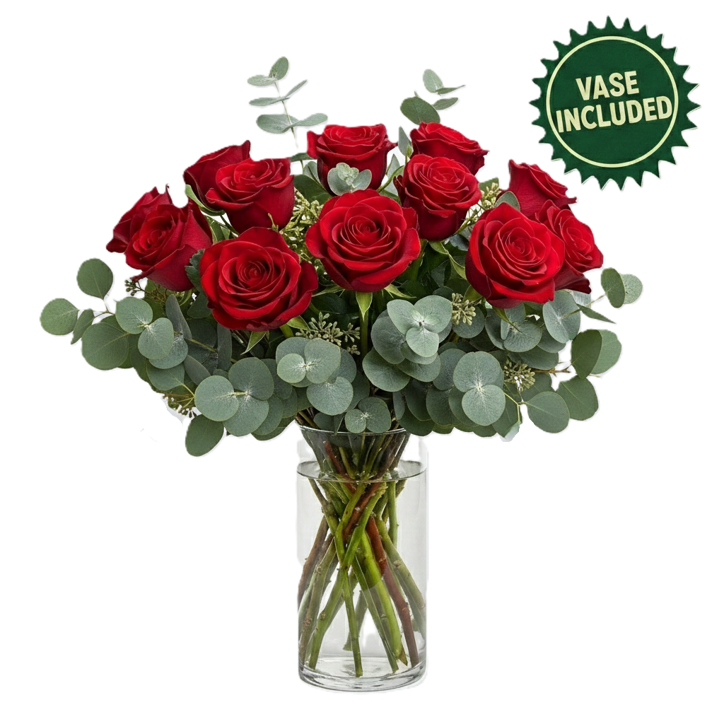 Elegant arrangement featuring twelve premium roses in a glass vase with seasonal greenery, hand-crafted for luxury delivery in South Auckland.
