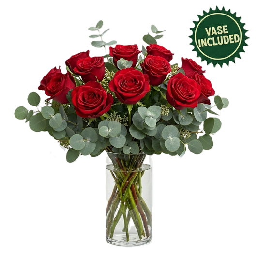 Elegant arrangement featuring twelve premium roses in a glass vase with seasonal greenery, hand-crafted for luxury delivery in South Auckland.