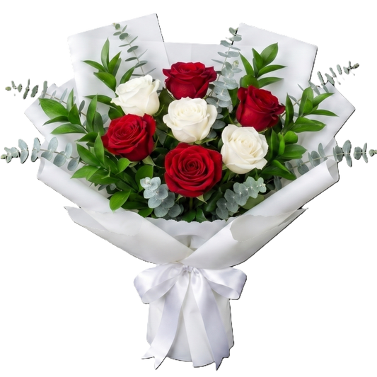 A hand-tied bouquet against a black background featuring three deep red roses and three white roses, with silver-dollar eucalyptus and green foliage, wrapped in layered white paper and tied with a white satin ribbon.