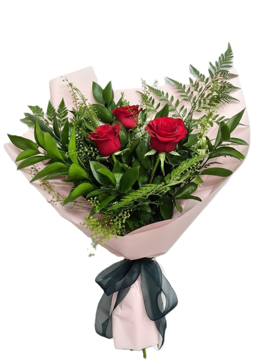 Elegant ruby trio bouquet featuring three premium red roses and fresh greenery, hand-crafted for romantic delivery in South Auckland.