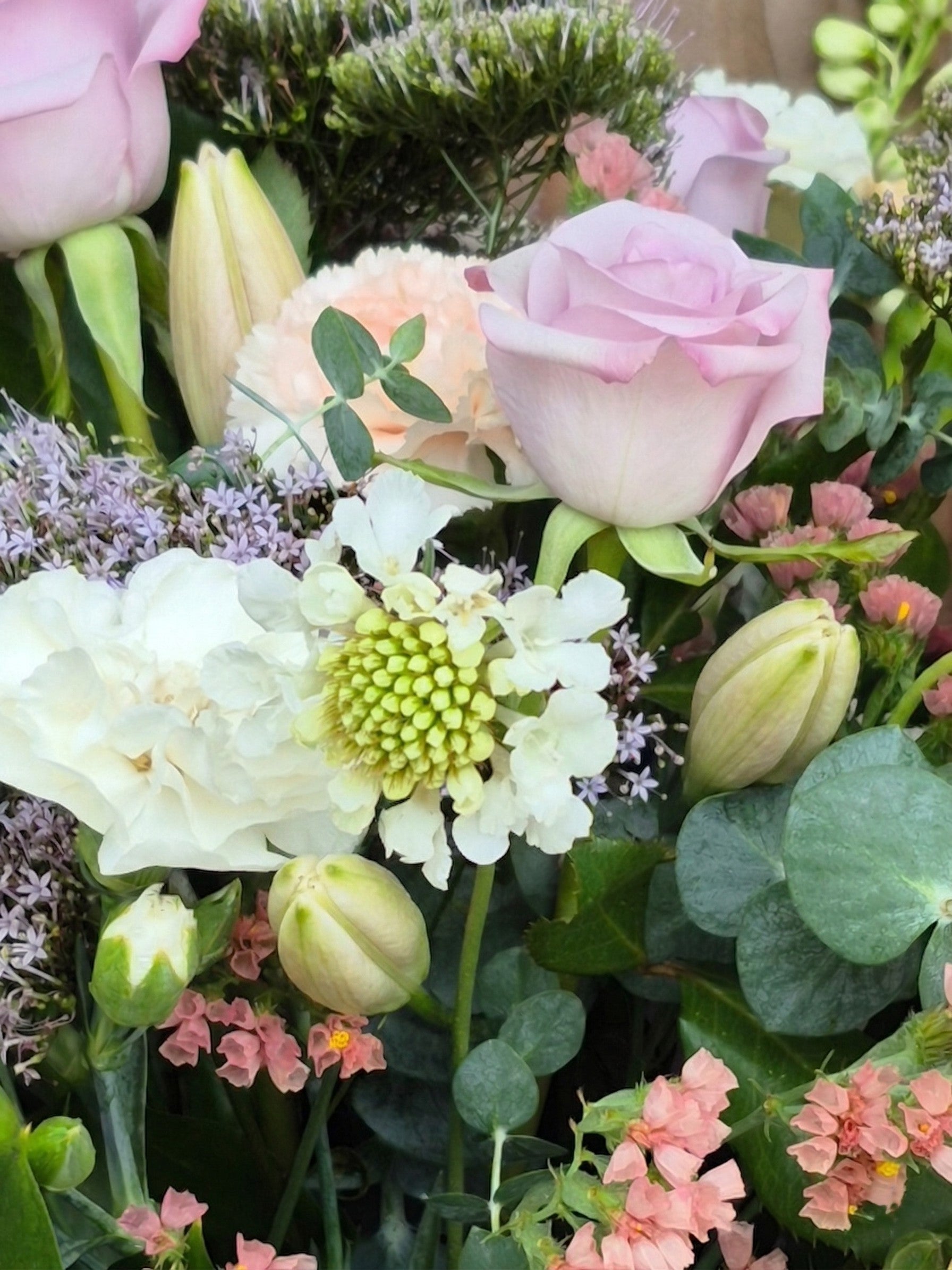 Elegant pastel flower bouquet featuring soft pink, peach, and cream blooms, hand-crafted for delivery in Auckland by Flowers on Ramarama.