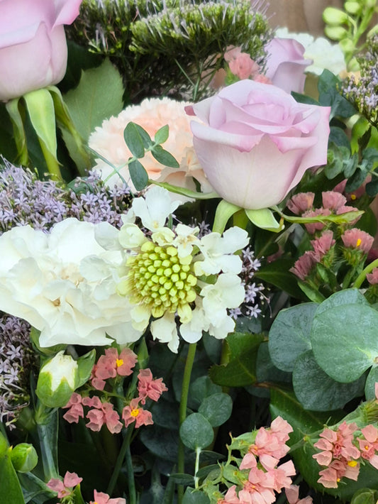 Elegant pastel flower bouquet featuring soft pink, peach, and cream blooms, hand-crafted for delivery in Auckland by Flowers on Ramarama.