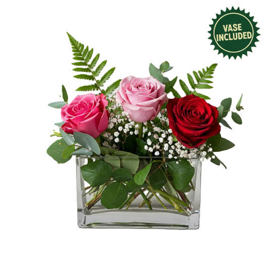Charming sweet sentiments flower arrangement in a glass cube vase, designed for delivery in South Auckland.