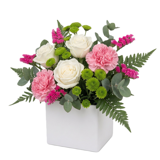A vibrant floral arrangement featuring white roses, pink carnations, green button chrysanthemums, and eucalyptus presented in a minimalist white cardboard box.1
