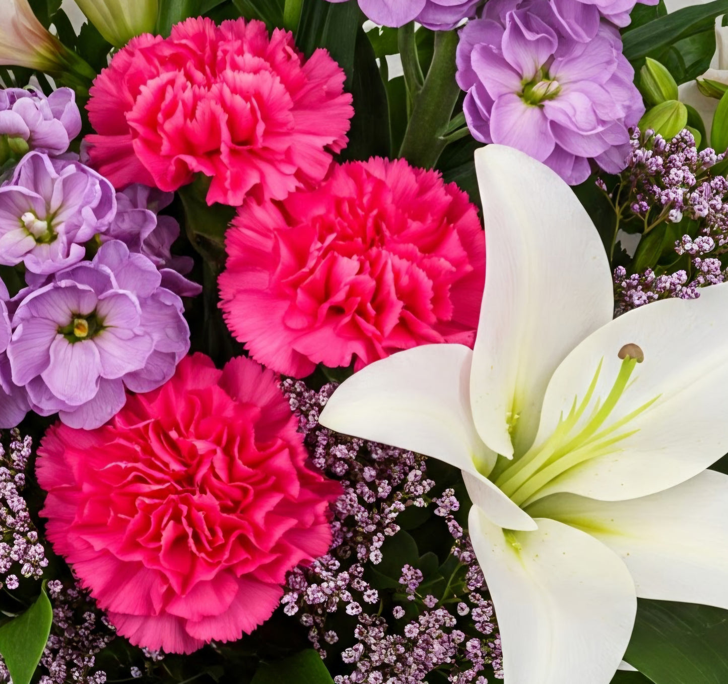 Bright and vibrant seasonal flower bouquet hand-crafted for celebration delivery in South Auckland.